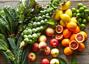 a group of fruits and vegetables on a wood surface Healthy Weight Loss Diets Leicester
